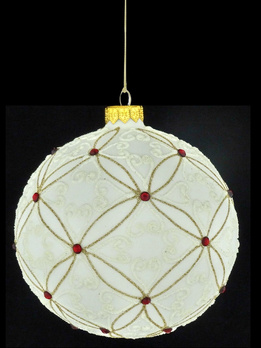 A glass Christmas bauble with ornamental decoration.
