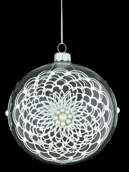 Glass Christmas ornament with ornamental decoration.