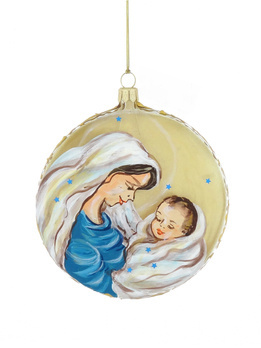 A glass bauble in the shape of a medallion with a Mary motif