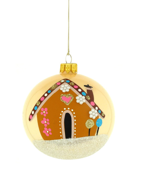 A glass Christmas tree ornament with a hand-painted gingerbread house