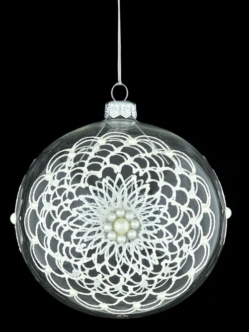 Glass Christmas ornament with ornamental decoration.