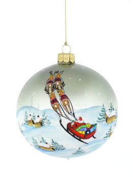 A glass Christmas bauble with a drawing of Santa's carriage