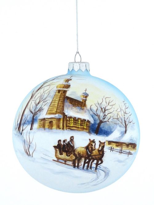 A glass Christmas tree bauble with a painted winter landscape with a winter sled motif